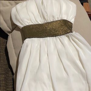 White belted low high strapless dress